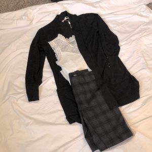 Black sweater jacket, white lace tank top, plaid dress pants